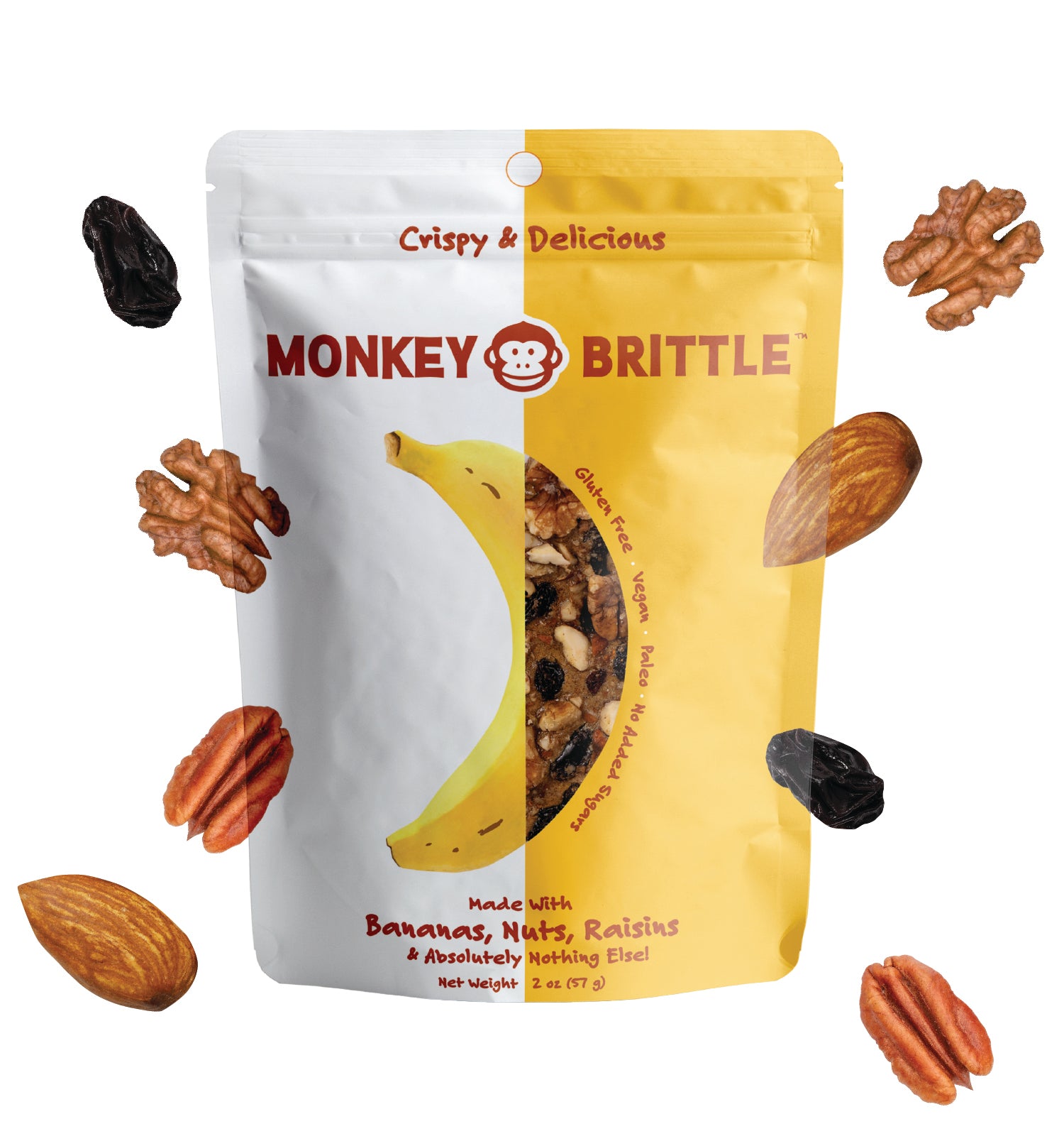 A bag of monkey brittle on a white background, with floating nuts and raisins surrounding it. The bag design is half yellow and half white, and features bananas, nuts and raisins. The words crispy and delicious are written at the top of the bag