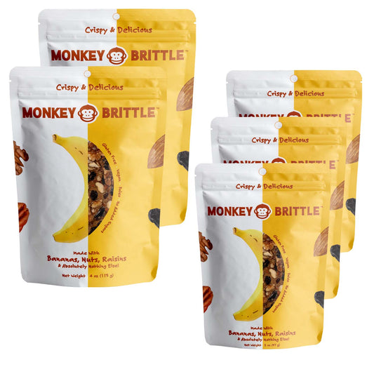 2 large and 3 small yellow and white resealable monkey brittle packs, featuring an organic banana in the center