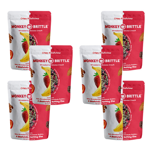 6 packs of strawberry flavor monkey brittle in white and pink resealable bags. In the center of the bag there is a banana and strawberry
